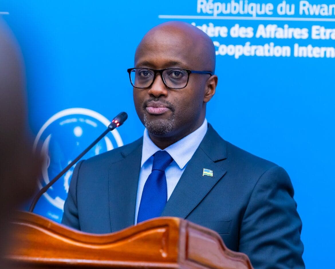 Olivier Nduhungirehe, Rwandan Minister of Foreign Affairs, speaking at a podium